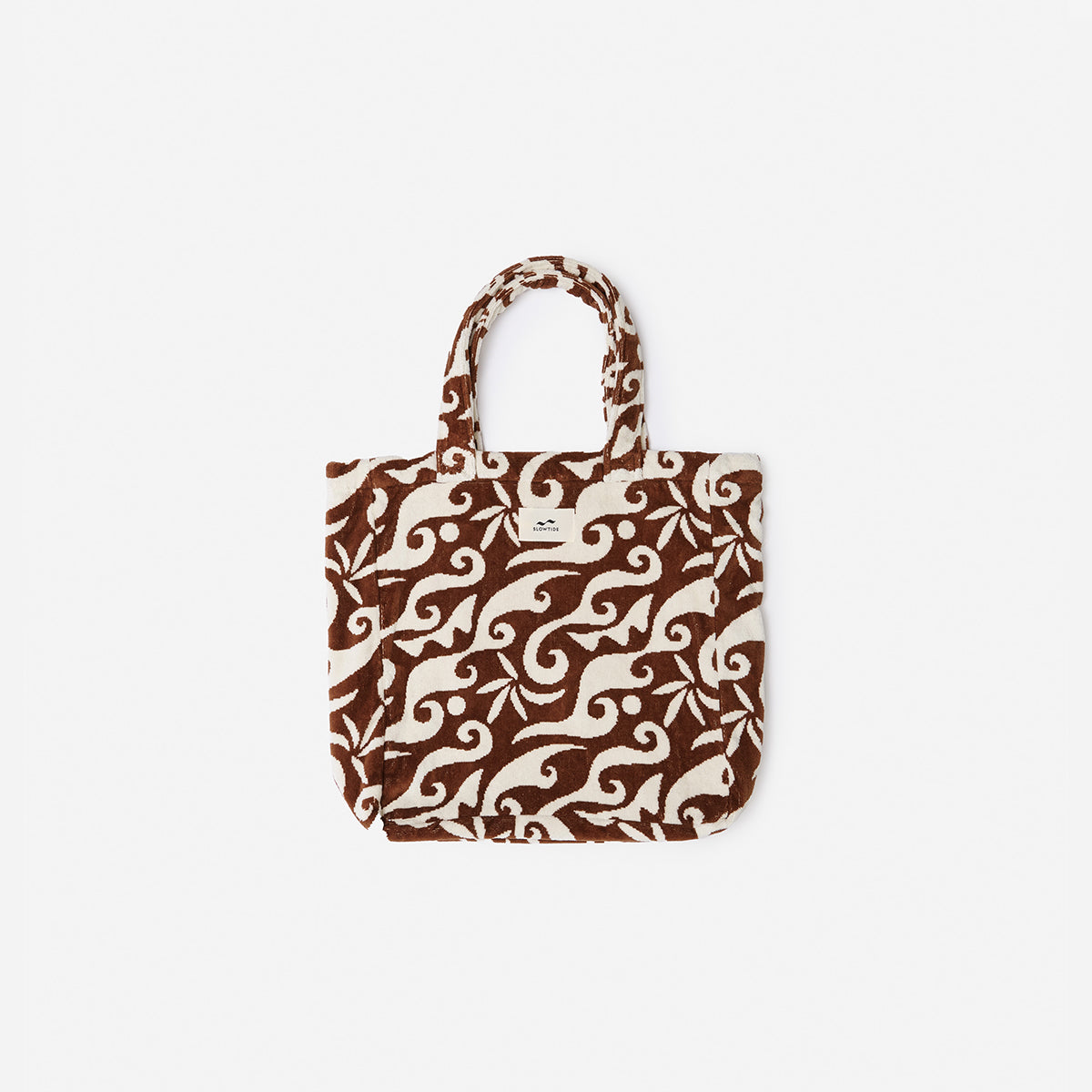 Tote bag with brown and cream swirl pattern and short handles.
