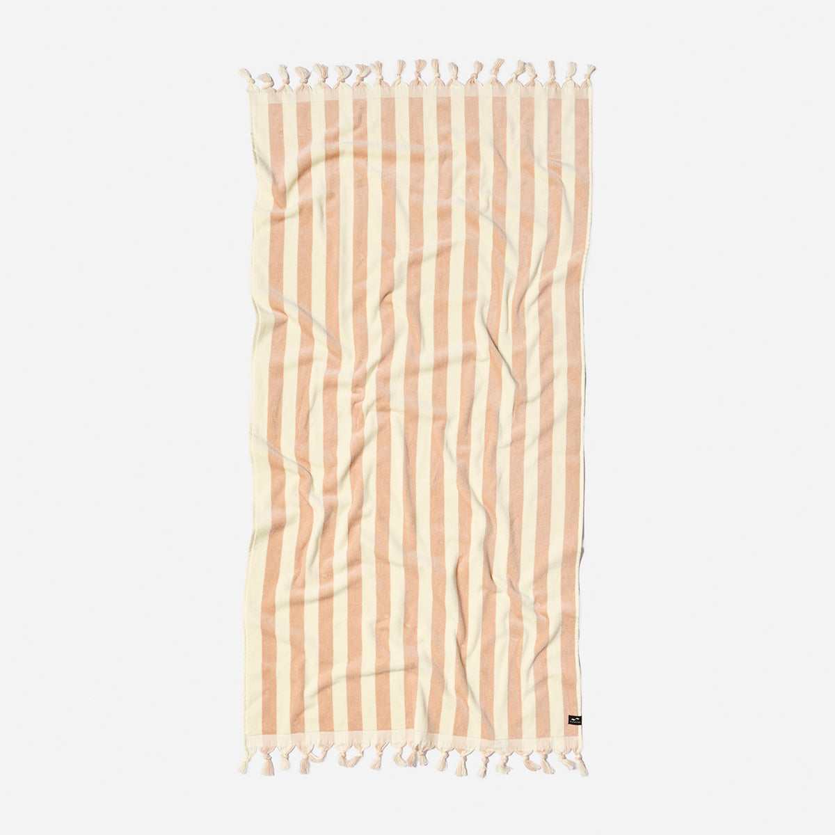 Beach towel, cotton blend, beige and white stripes with tassel fringe, flat on white surface.