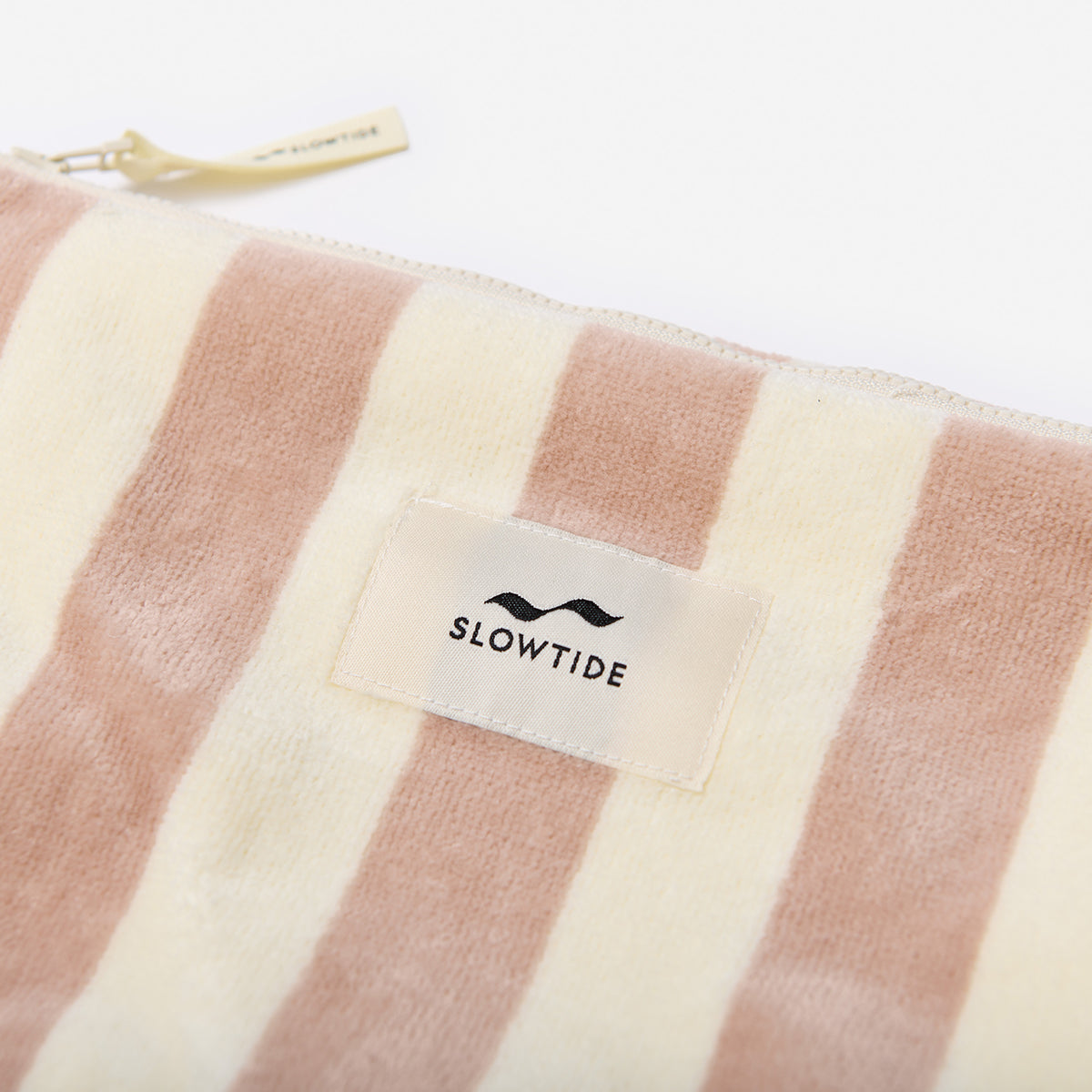 Cotton canvas organizer pouch with beige and white stripes and zipper closure.