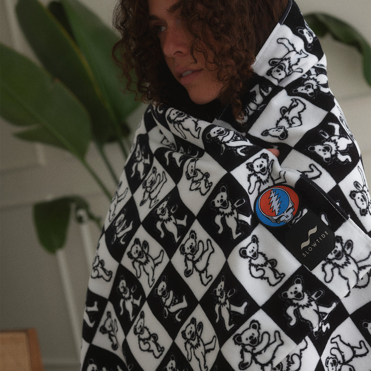 Cotton blanket with black and white checks, dancing bears, and lightning bolt pattern.