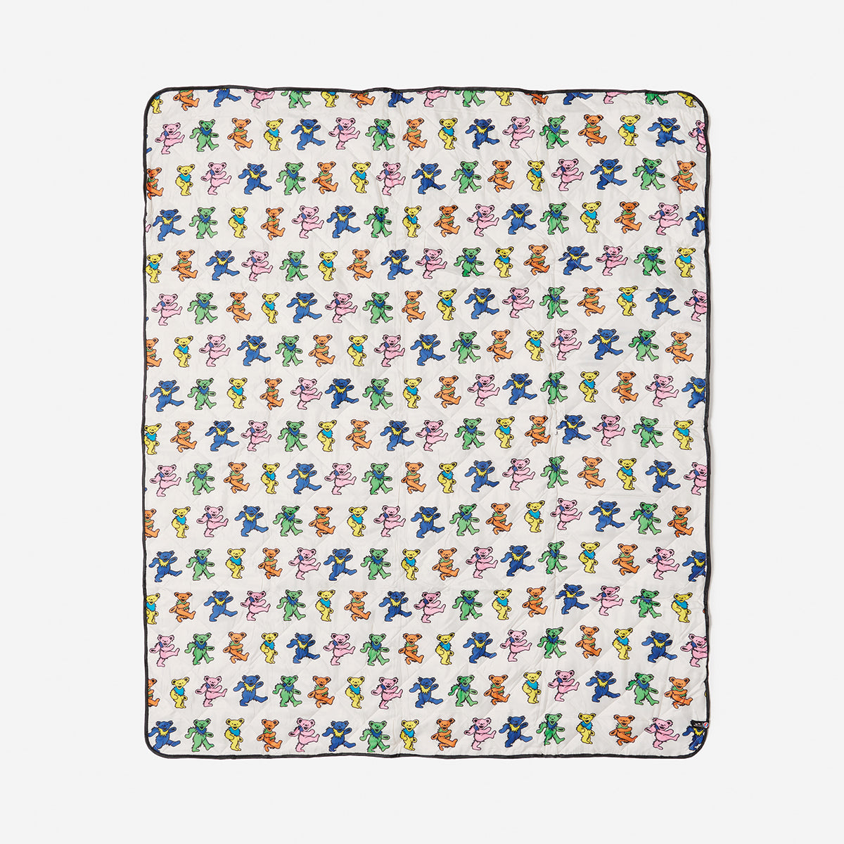 Blanket with colorful bear pattern on white, lightweight for outdoor use.