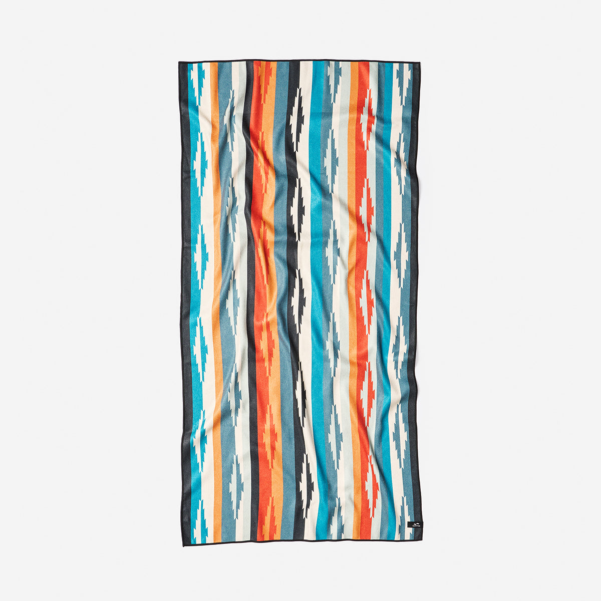 Oversized beach towel with blue, orange, and white geometric stripes.