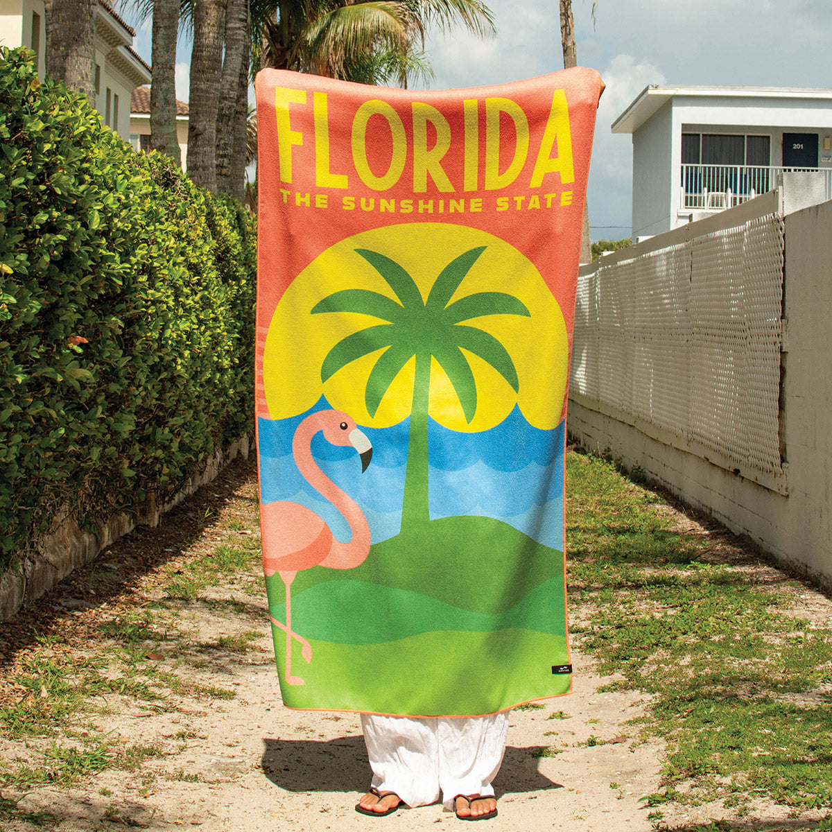 Quick-drying towel with flamingo, palm tree, and sun print.