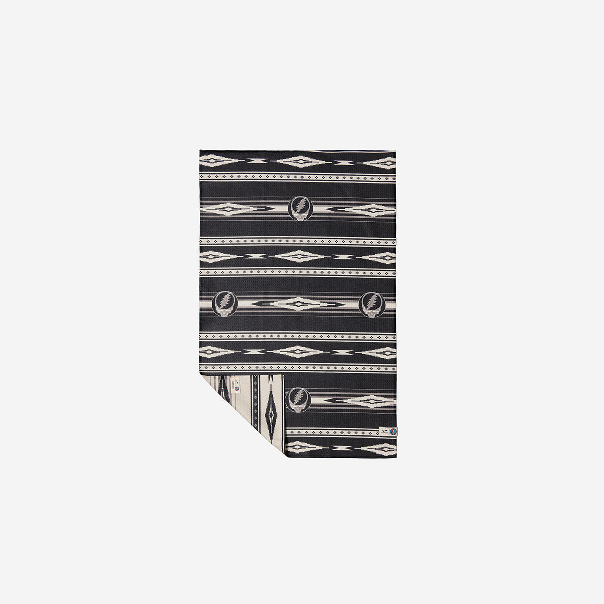 Blanket with black and white geometric diamond pattern and vintage-inspired design.