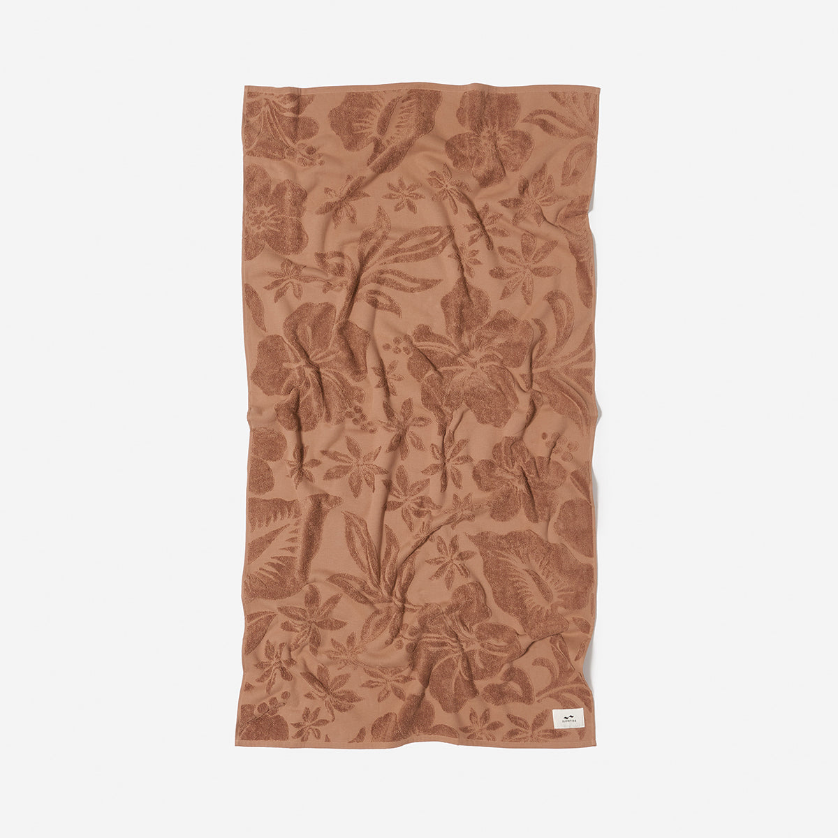 Brown cotton towel with floral pattern, absorbent and sustainably sourced.