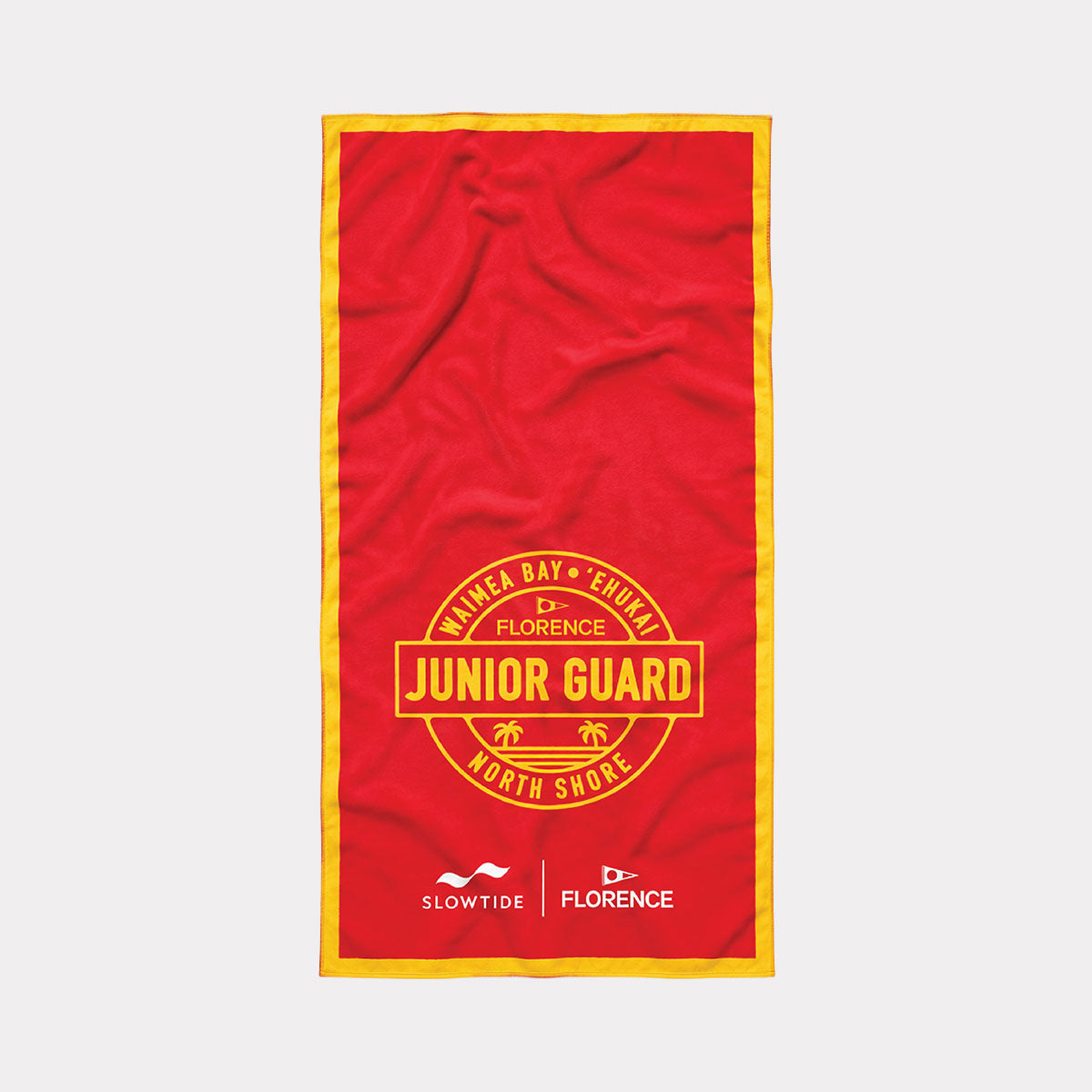 Junior Guard beach towel in red with yellow trim and quick-dry fabric.