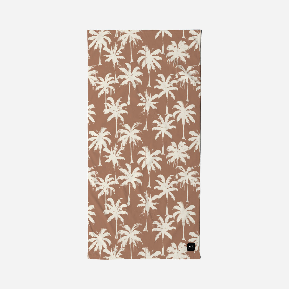 Velour towel with white palm tree pattern and small black tag in the corner.