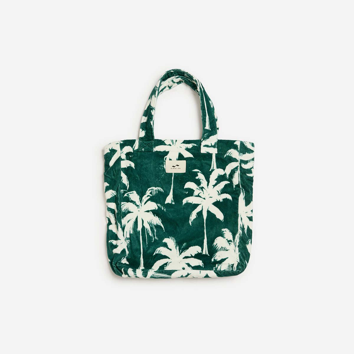Green cotton tote bag with white palm tree print, sustainable material.