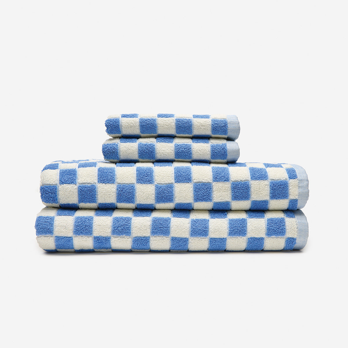 Absorbent towels, cotton, blue and white checkered pattern, set of four stacked.