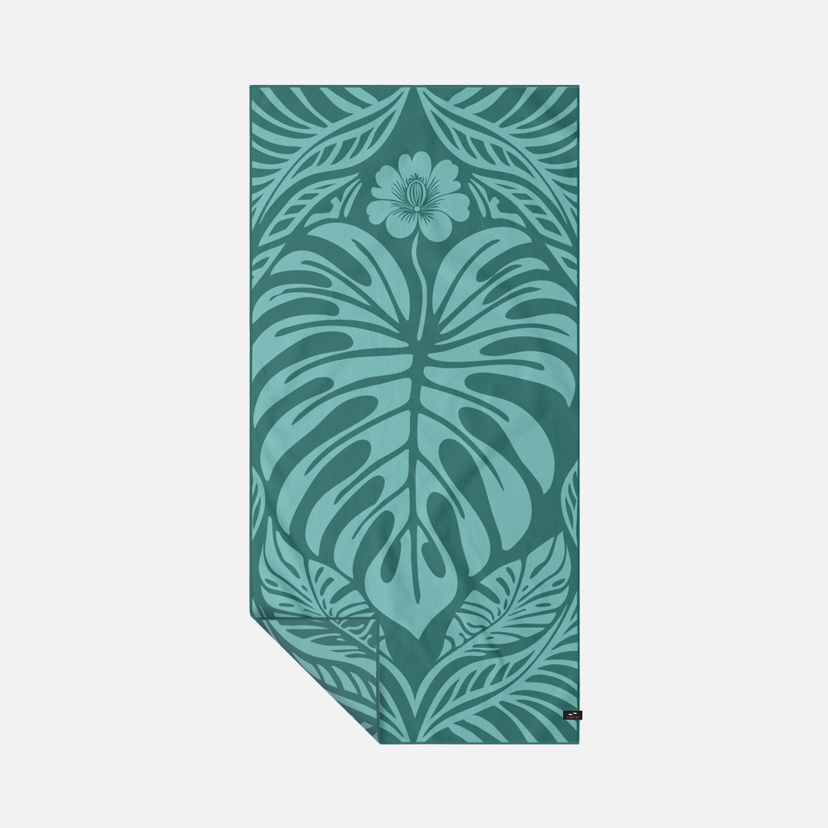 Teal quick-dry towel with large monstera leaf and floral pattern, leafy border design.
