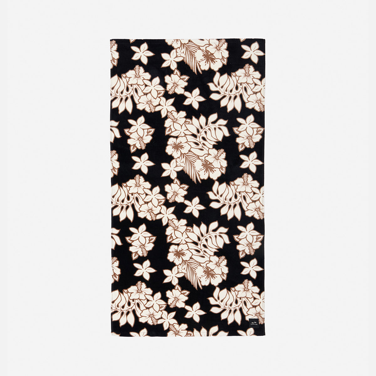 Plush velour towel with black and white floral and beige leaf print on black background.