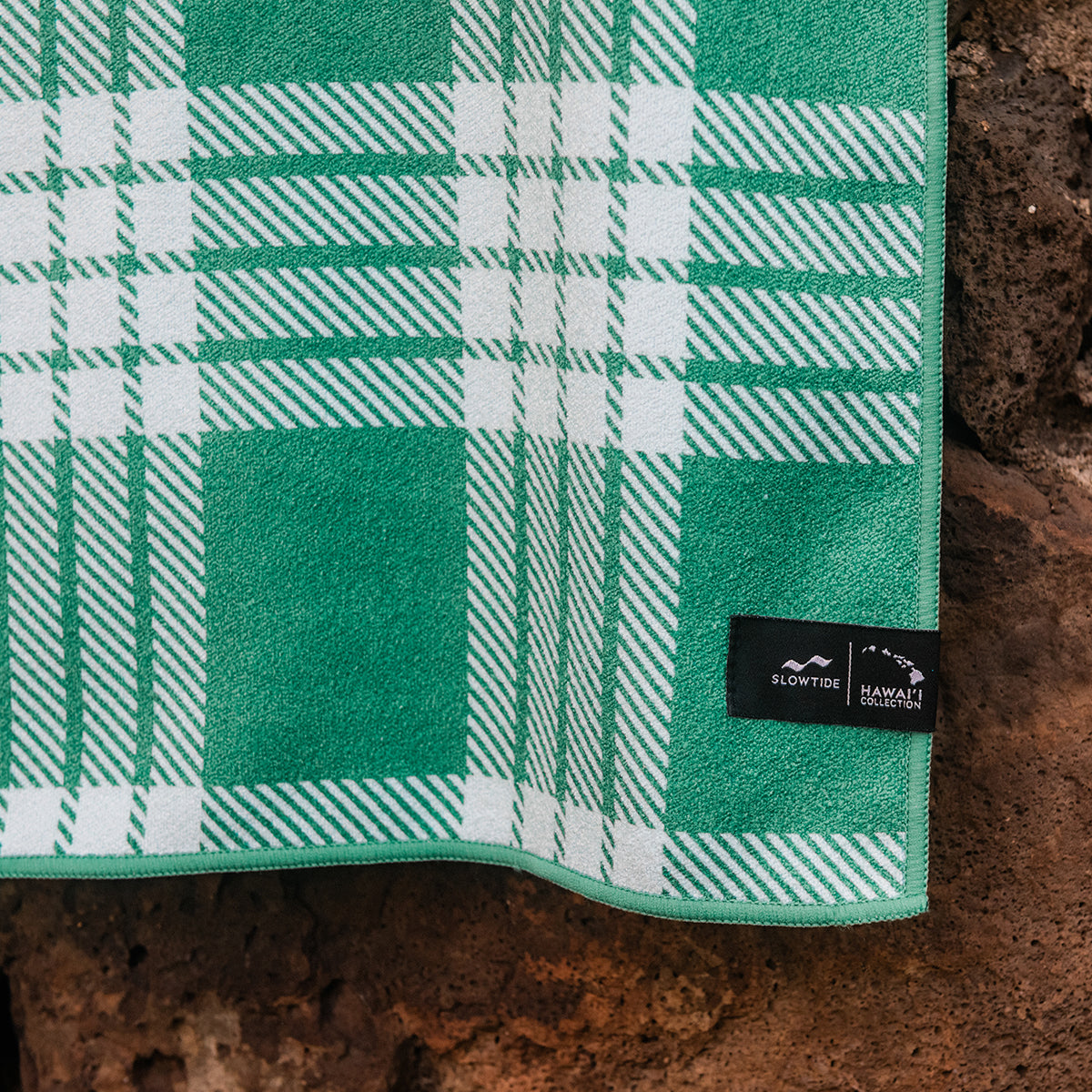 Travel towel, green and white plaid pattern, sustainable fabric, black label.