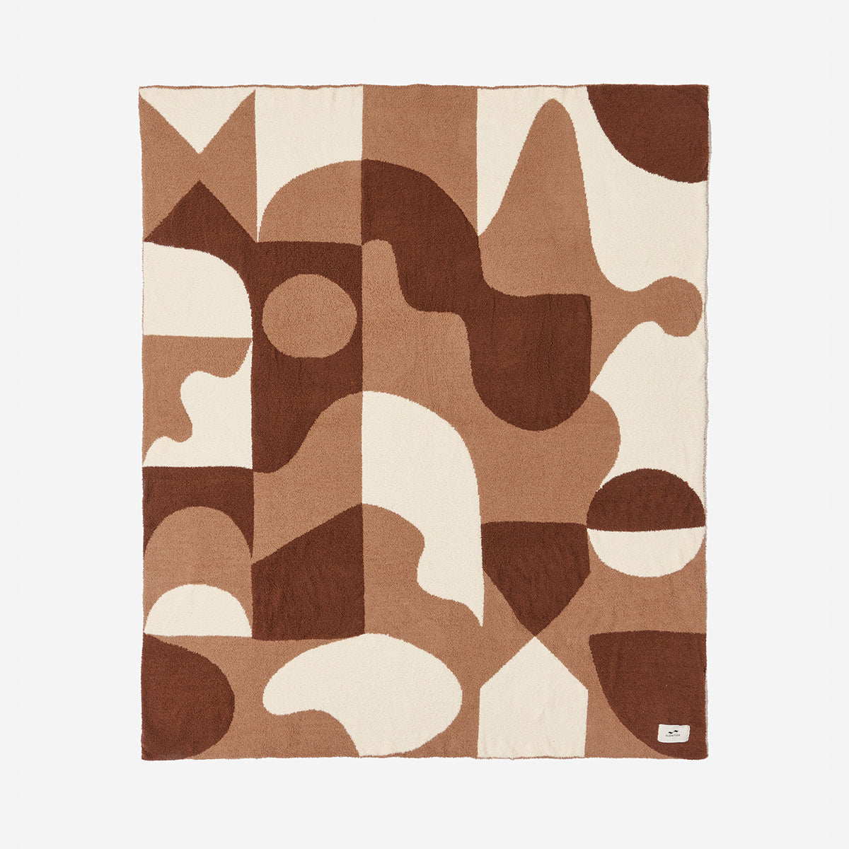 Reversible plush throw blanket in a brown and cream geometric abstract pattern.