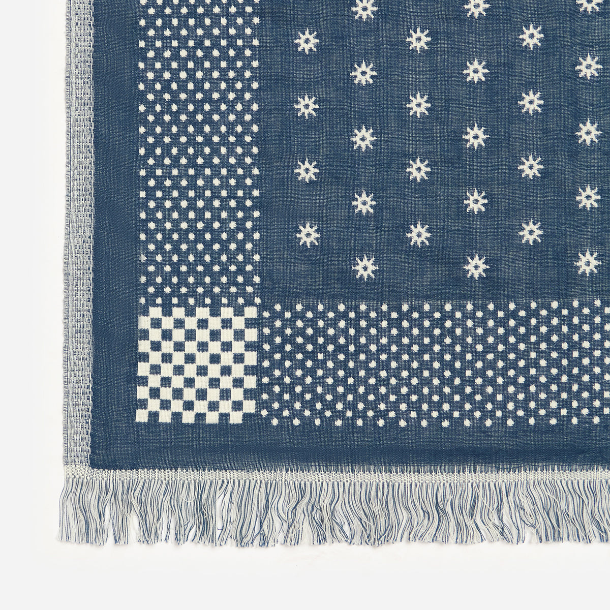 Turkish cotton towel with blue geometric and star patterns, white fringe trim.