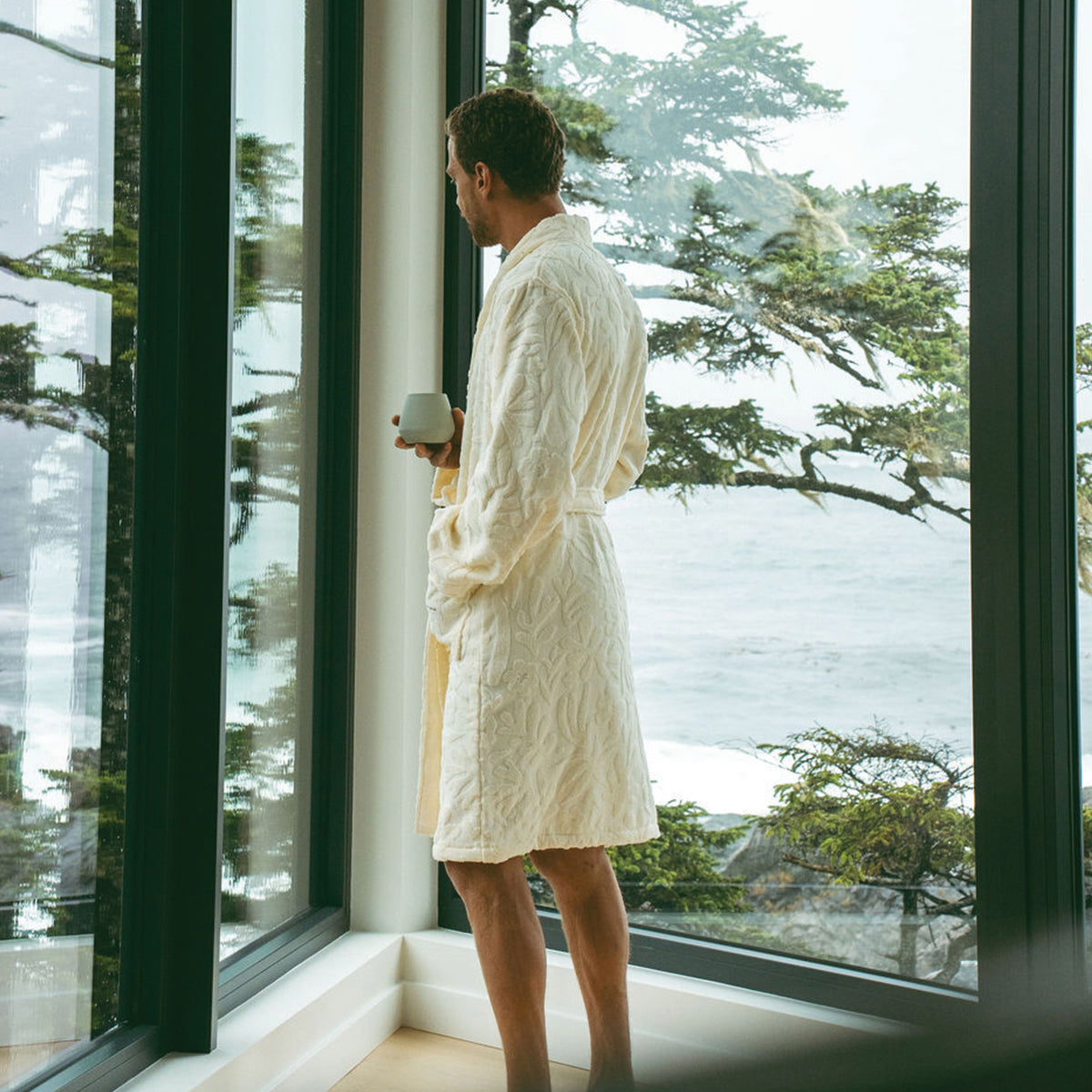 Plush cotton robe in cream featuring a textured finish and waist tie.