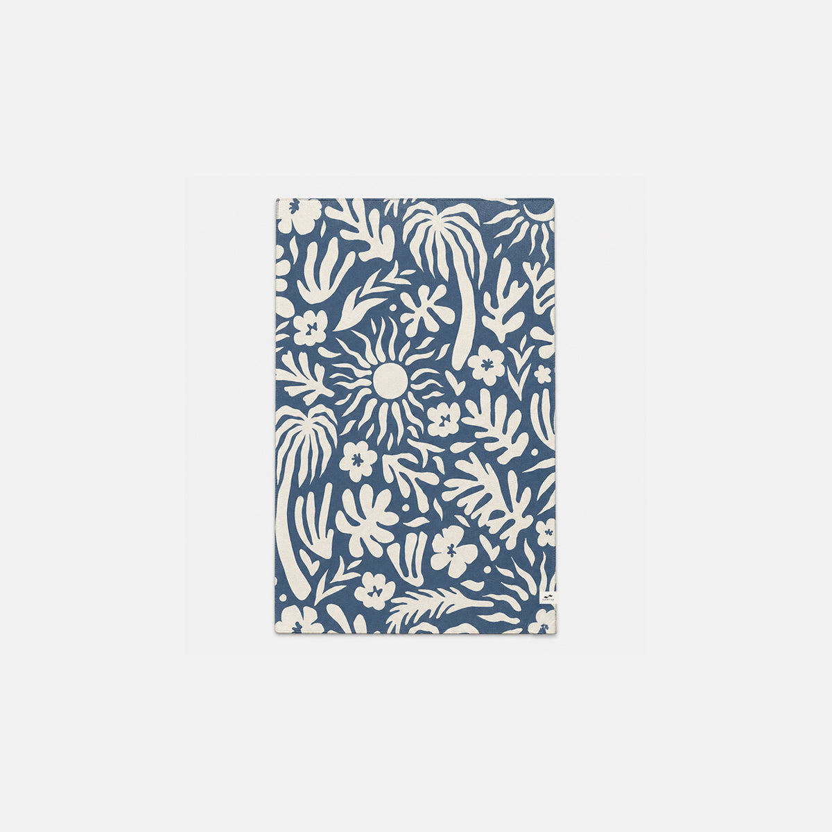 Blue and white rug with sun, palm trees, and flowers pattern for home decor.