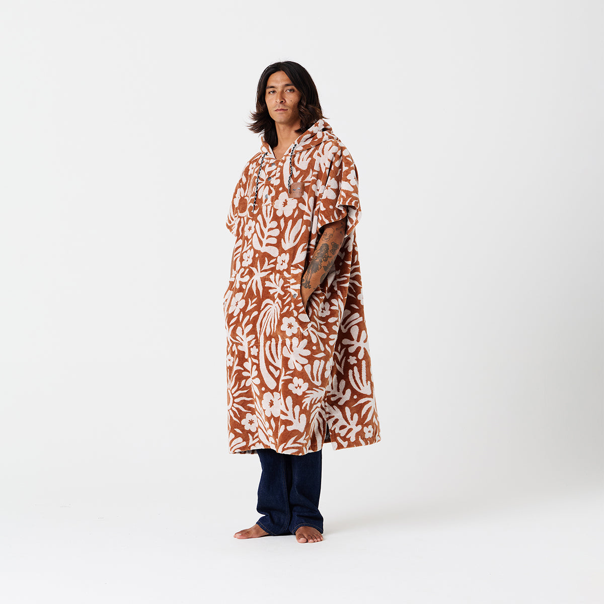Changing poncho in rust and white floral cotton terry.
