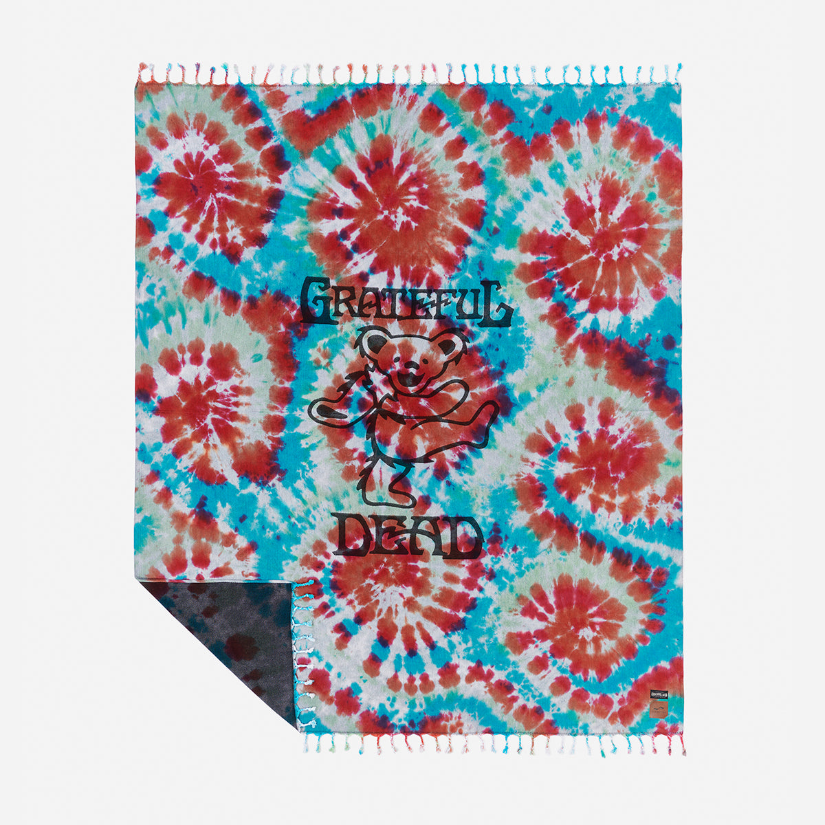 Oversized cotton blanket with dancing bear and colorful tie-dye pattern.