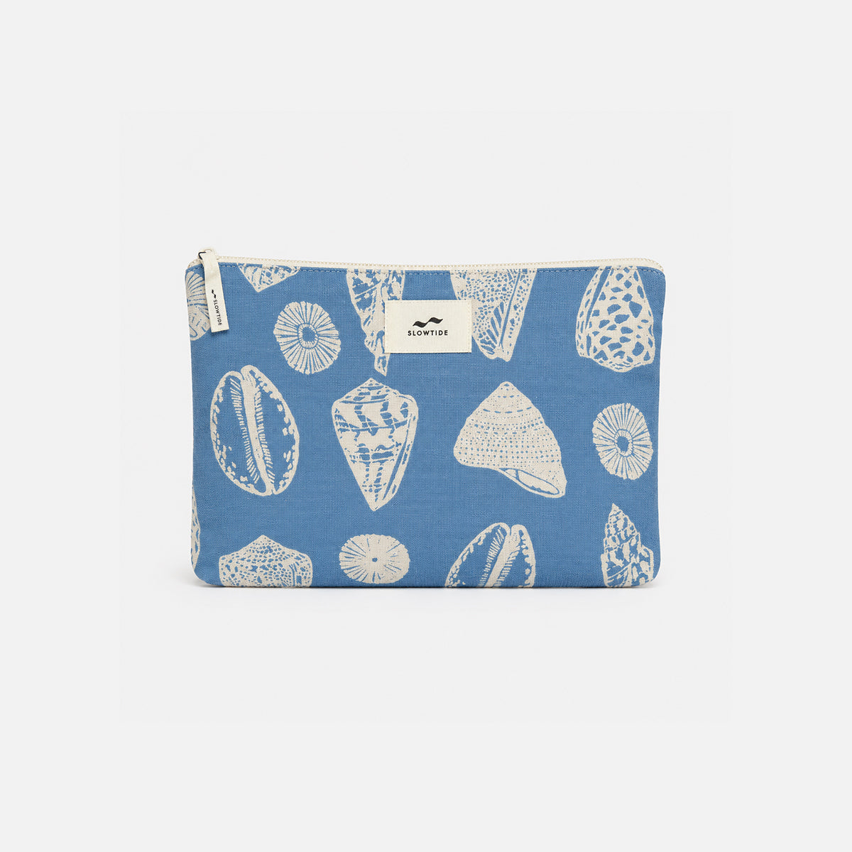 Cotton pouch with white seashell print, top zipper, and center label for travel essentials.