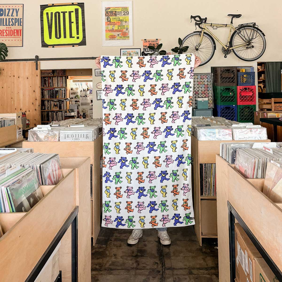 Velour towel with a colorful dancing bear pattern.