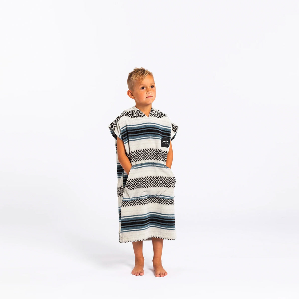 Kids hooded poncho in cotton terry with blue and black tribal stripes and a pocket.