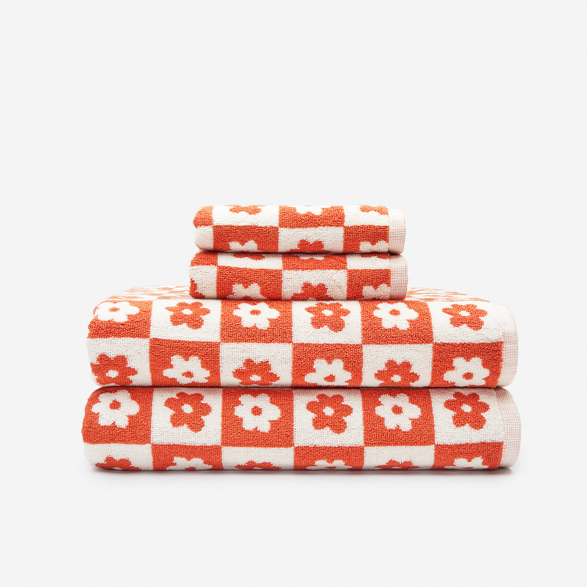 Bath towel set, cotton, red and white floral geometric checkerboard pattern.