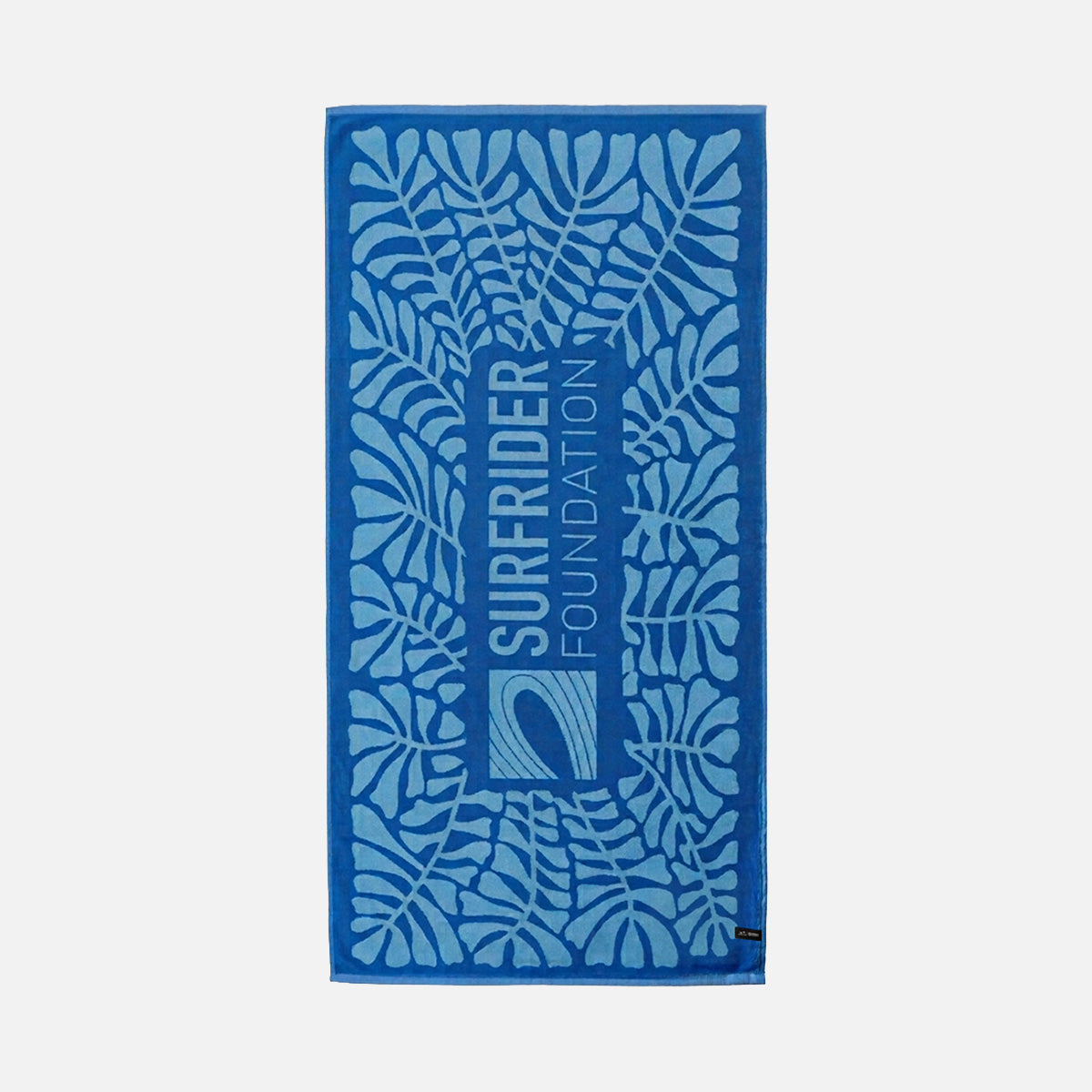 Blue cotton beach towel with leaf pattern and text, made from sustainable materials.