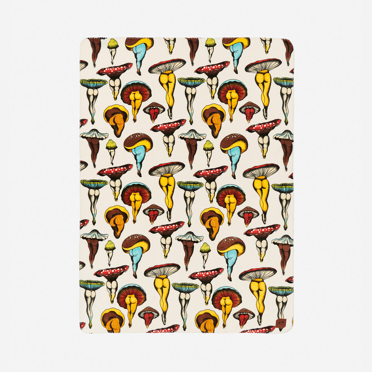 A rectangular object with a repeating pattern of colorful mushrooms in yellow, red, blue, and brown hues on a light background. The mushrooms vary in shape and size, arranged in a whimsical, artistic style.