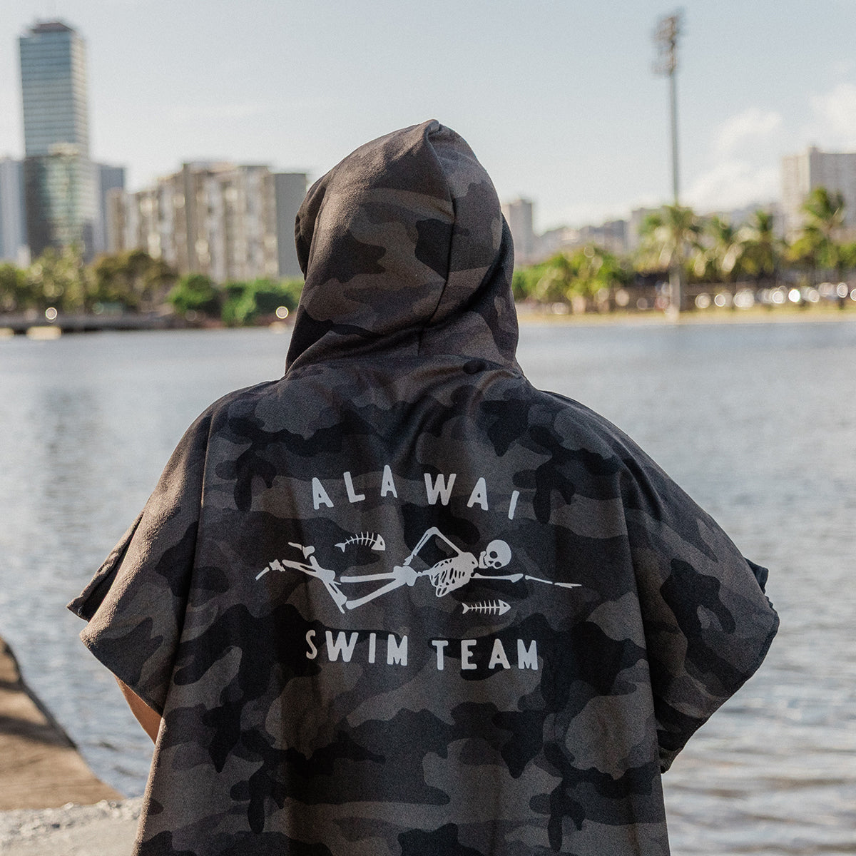 Camo hoodie in sustainable fabric with swim team text.