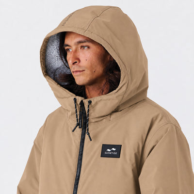 Tan hooded all-weather parka with insulation for comfort and style.