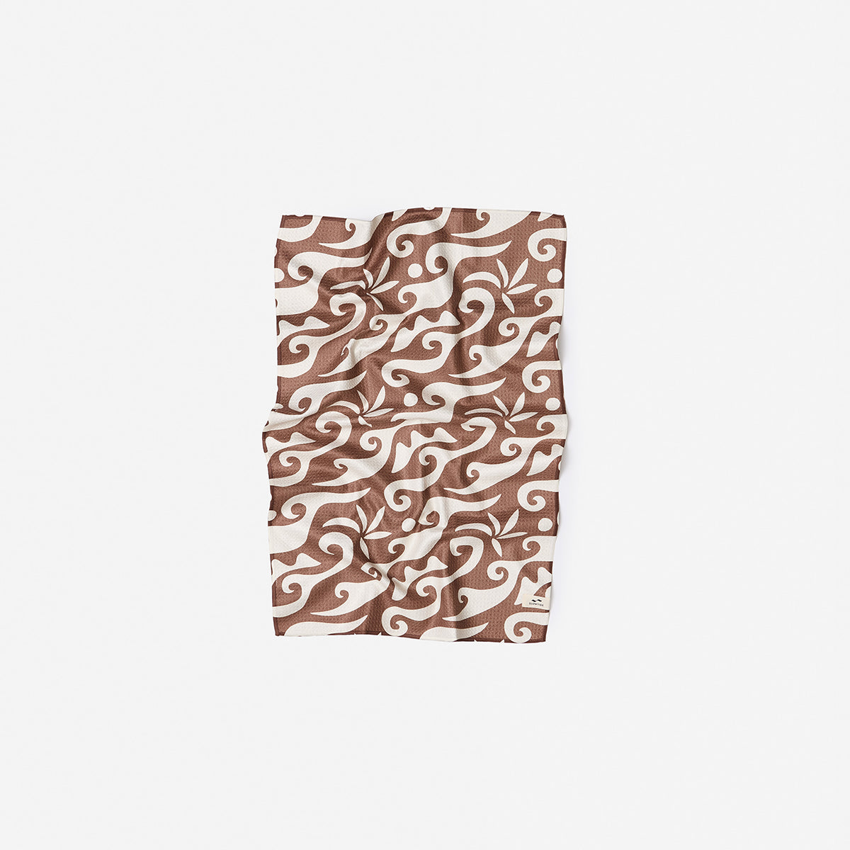 Sand resistant towel, brown and white abstract swirl pattern on white background.