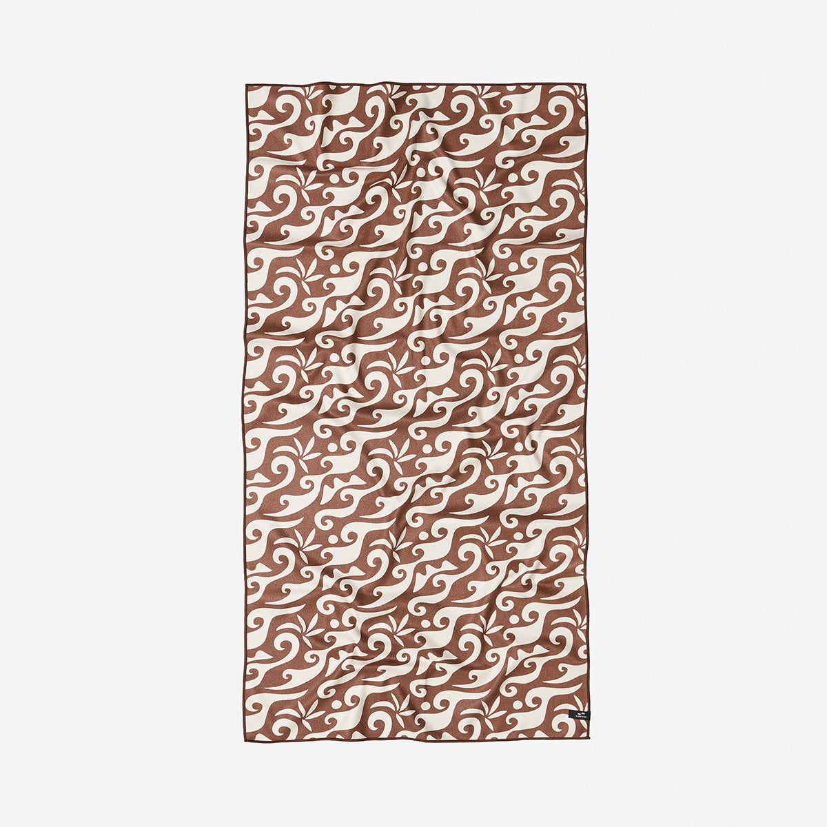Adventure blanket, recycled material, brown and cream with swirling wave pattern.