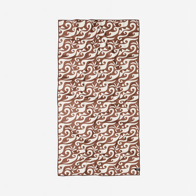 Adventure blanket, recycled material, brown and cream with swirling wave pattern.