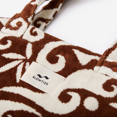 Tote bag with brown and white swirl pattern.