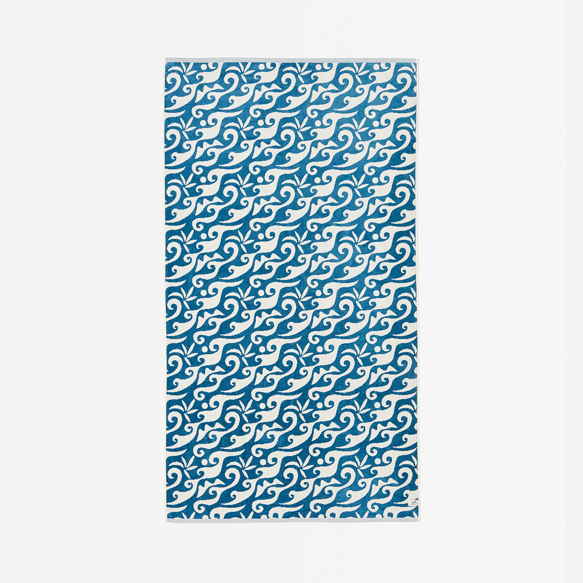Blue and white rug with swirling wave pattern.