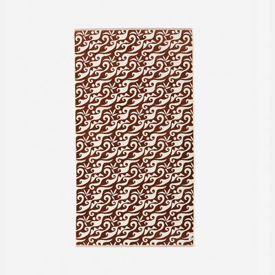 Towel with brown and white swirling wavy line pattern.