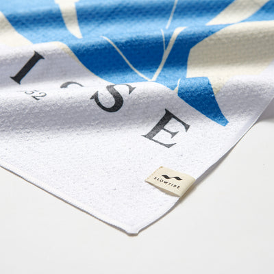 Kitchen towel, cotton, white and blue stripes, close-up of corner detail.
