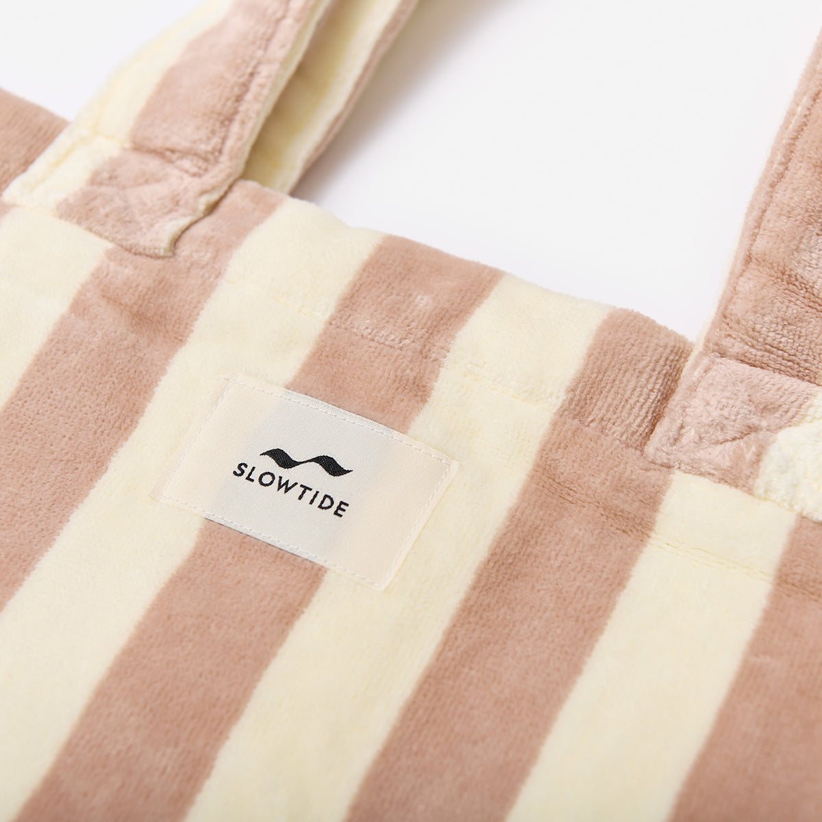 Cotton canvas beach bag with beige and cream stripes.