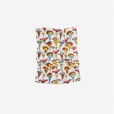 Dish towel with colorful mushroom pattern on white background, sustainable fabric, slightly wrinkled.
