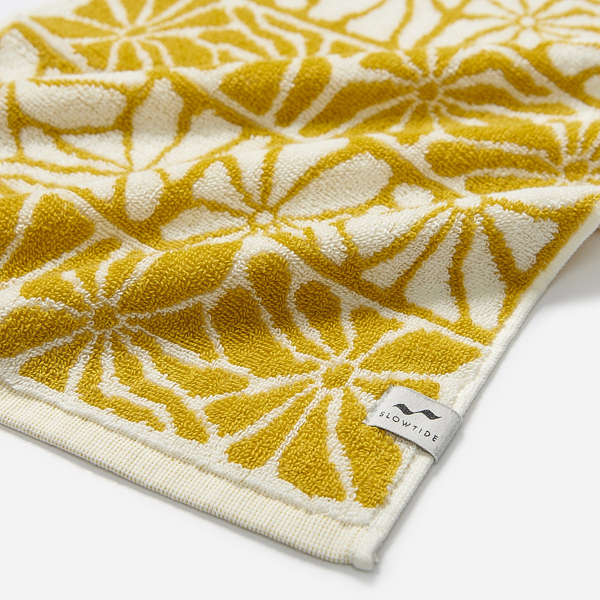 Hand towel, 550 GSM cotton, yellow and white floral pattern.
