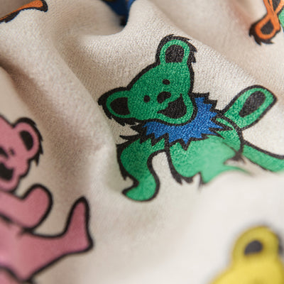 Quick-dry towel made from recycled materials with colorful cartoon bear pattern.