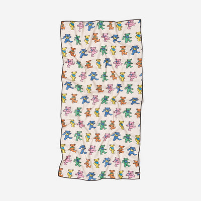 Quick-dry recycled towel with colorful dancing bears pattern on white background.