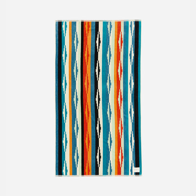 Colorful striped towel with geometric pattern on a white background