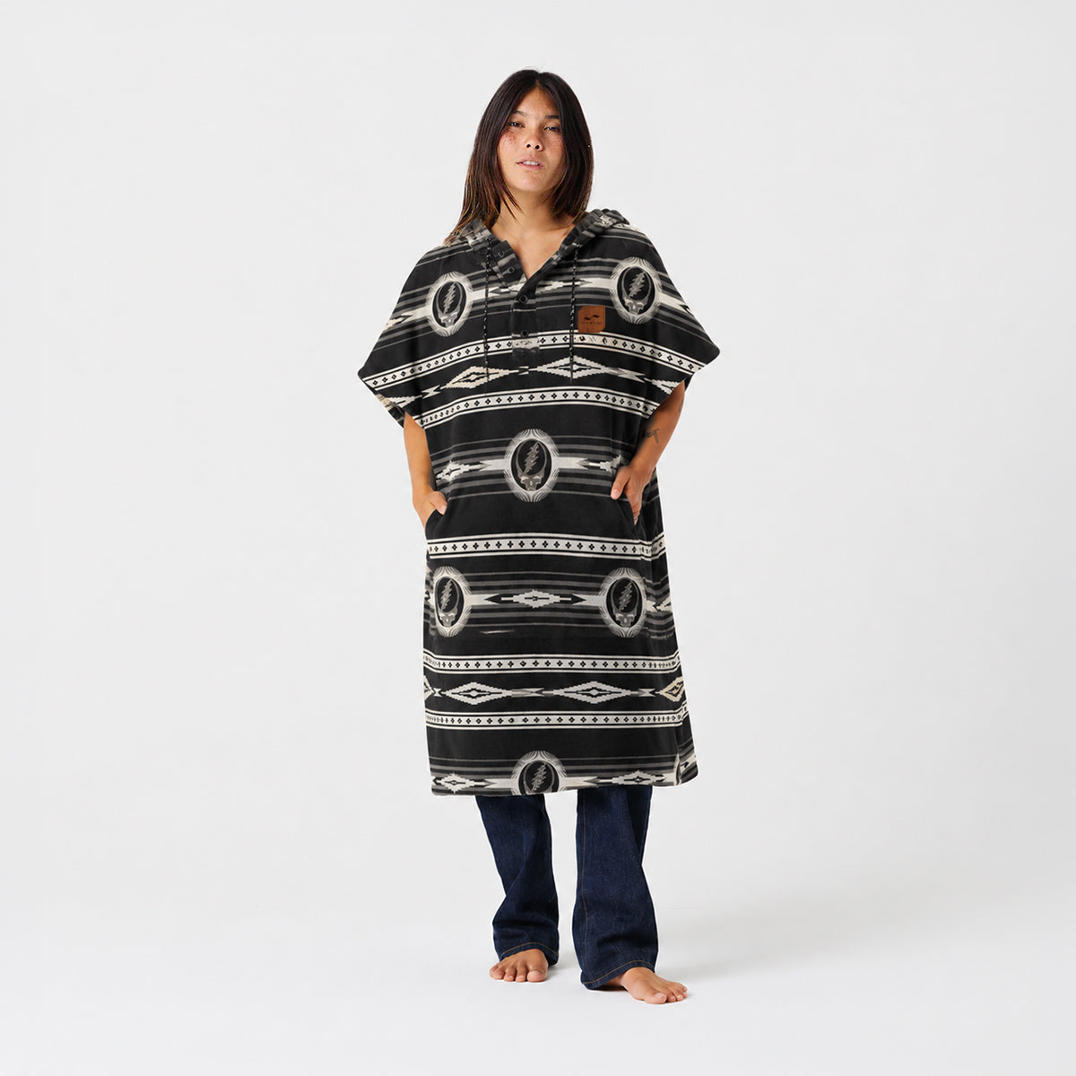 Patterned towel poncho with geometric design.