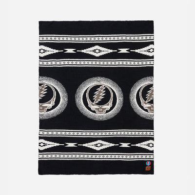 Throw blanket with skull, lightning bolt, and geometric patterns in black and white.