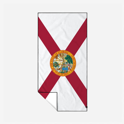 Beach towel with Florida flag red X and state seal, white quick-dry fabric.
