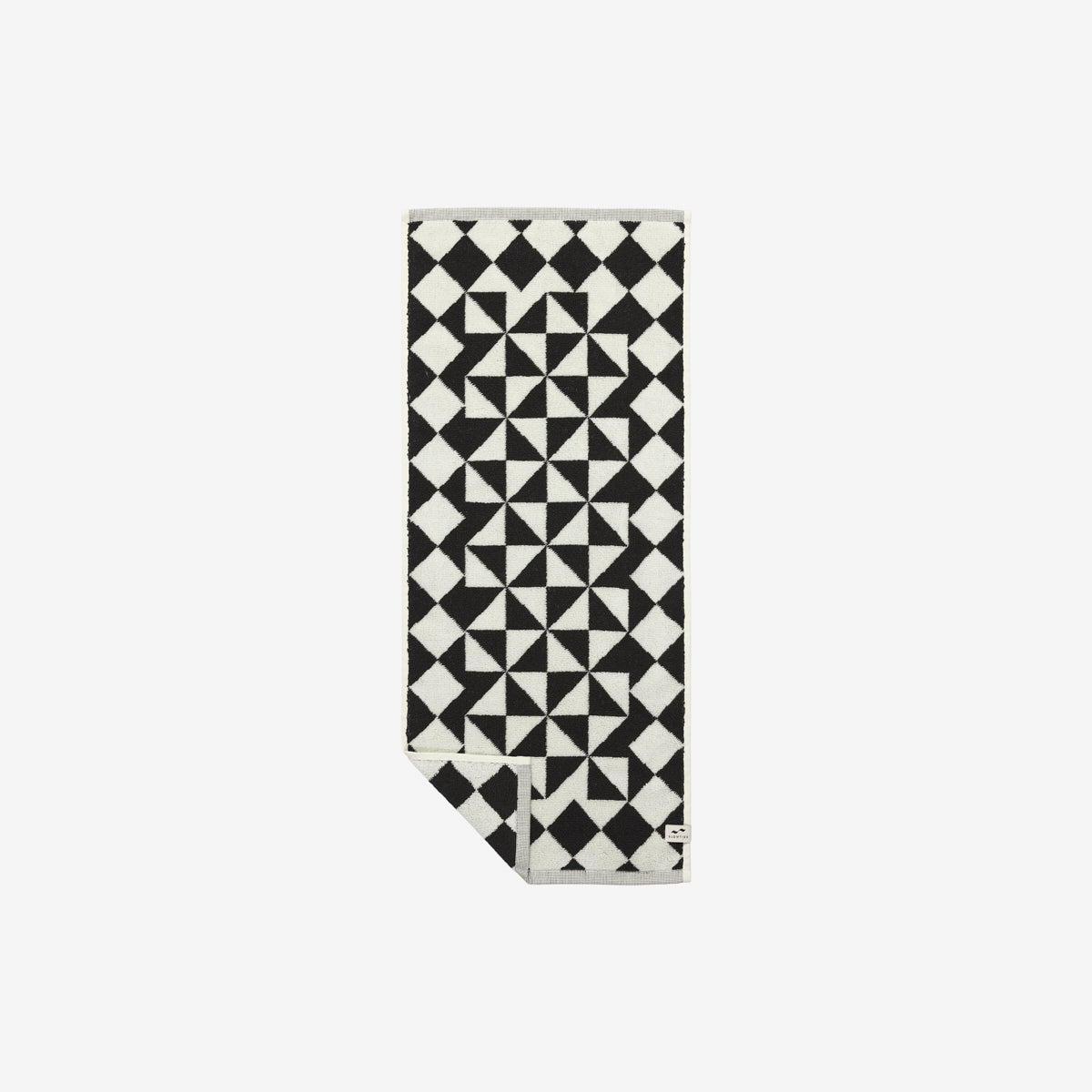 Hand towel, cotton, black and white geometric pattern, folded corner.