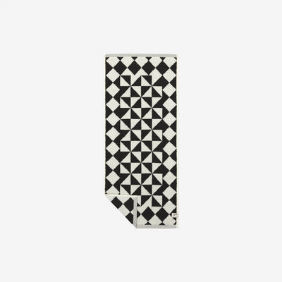 Hand towel, cotton, black and white geometric pattern, folded corner.