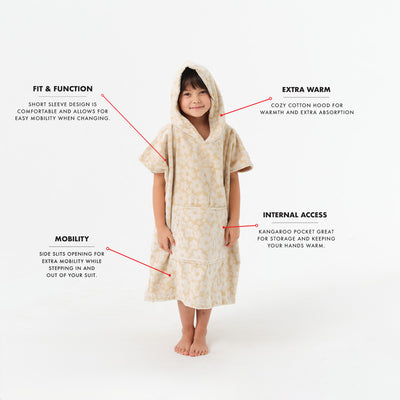 Kids cotton terry poncho with cozy warmth and easy movement.