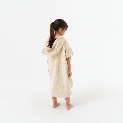 Kids hooded cotton terry poncho with floral pattern.